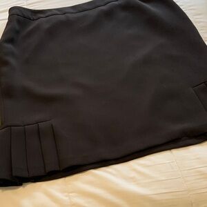 Brown skirt with pleats on both sides at the bottom. Women’s 16